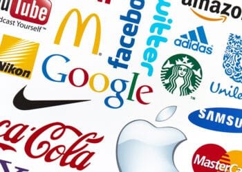 KIEV, UKRAINE - FEBRUARY 21, 2012: A logotype collection of well-known world brand's printed on paper. Include Google, McDonald's, Nike, Coca-Cola, Facebook, Apple and more others logo.